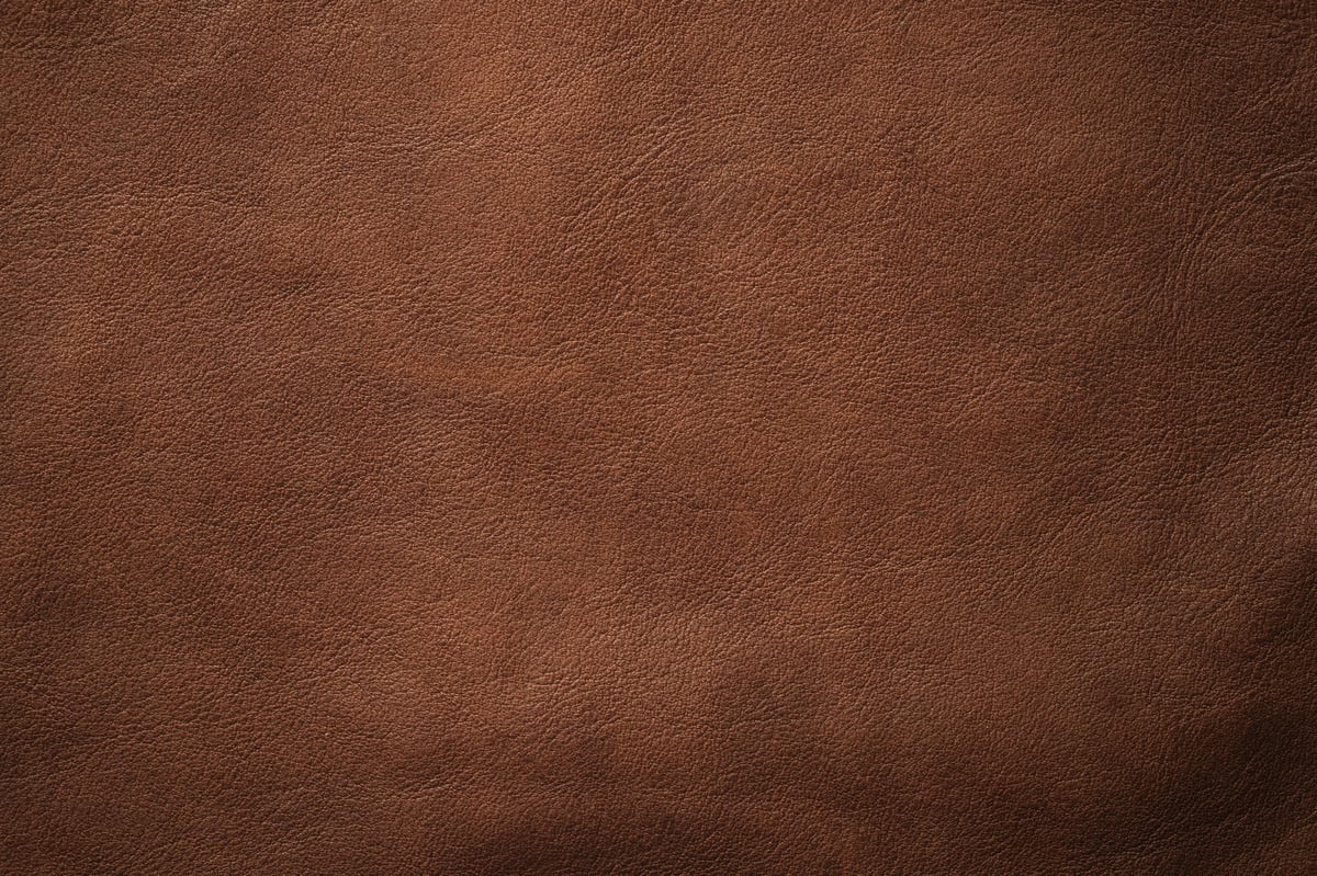 natural leather texture background, brown cowhide closeup